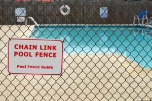 Chain link swimming pool fence barrier