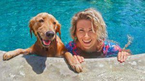 older dog and woman at edge of pool Pet Fence for Dog